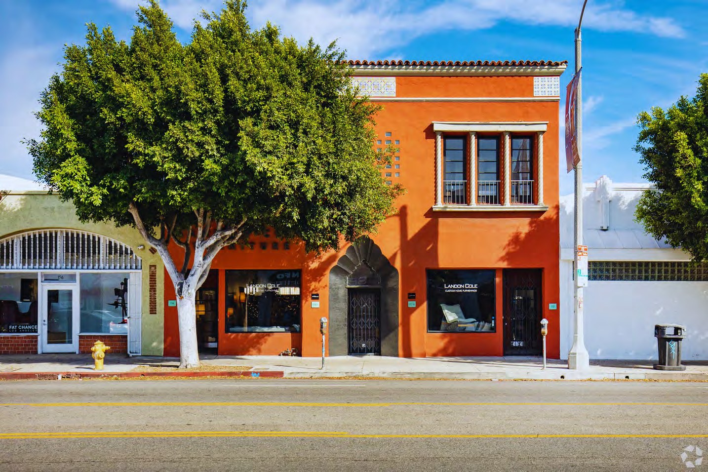 The Archway Building, an orange Spanish-revival storefront building at 152 North La Brea Avenue