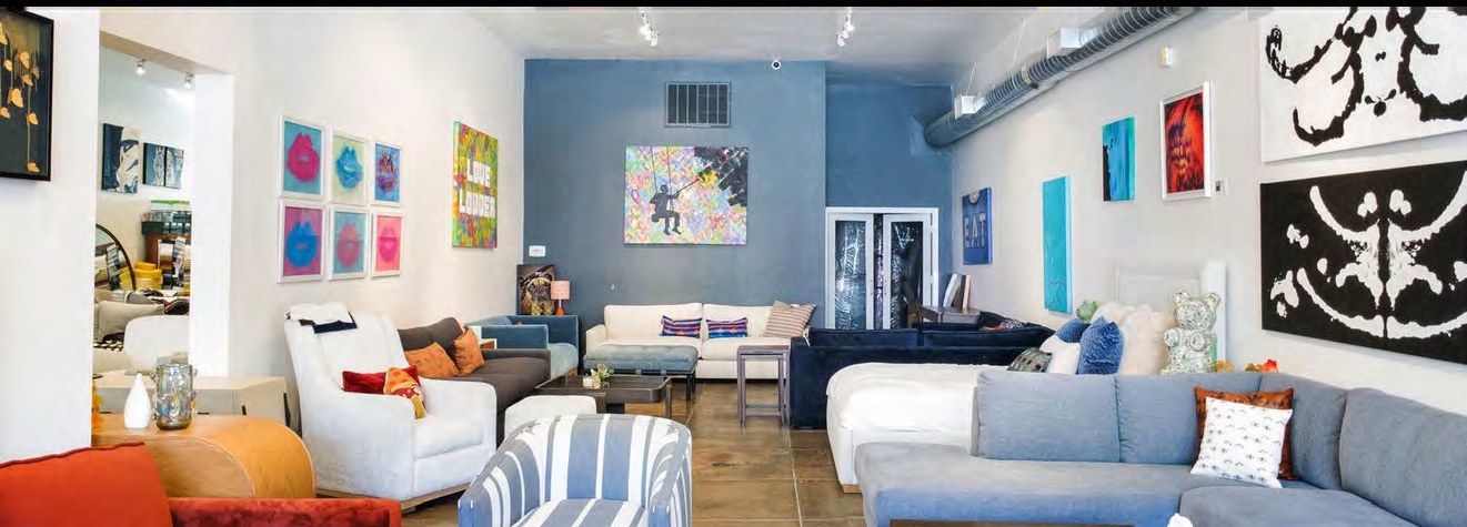Gallery-style interior walls displaying art within the ground floor space